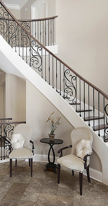 wrought iron stairway with tile flooring